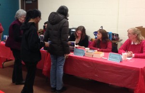 Kristin Bailey/Jess Granger (middle) signs a book for a reader while Stacy McKitrick (right) and I watch.